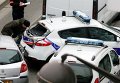 Автомобили полиции на месте стрельбы возле офиса издания Charlie Hebdo в Париже Автомобили полиции на месте стрельбы возле офиса издания Charlie Hebdo в Париже