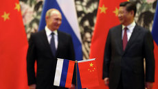 Президент России Владимир Путин и председатель КНР Си Цзиньпин. Архивное фото Президент России Владимир Путин и председатель КНР Си Цзиньпин. Архивное фото