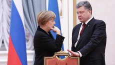 Канцлер Германии Ангела Меркель и президент Украины Петр Порошенко. Архивное фото Канцлер Германии Ангела Меркель и президент Украины Петр Порошенко. Архивное фото