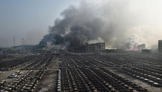 Последствия взрывов на складе опасных веществ в промышленном городе Тяньцзин, Китай. Архивное фото Последствия взрывов на складе опасных веществ в промышленном городе Тяньцзин, Китай. Архивное фото