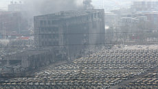 Последствия взрывов в Тяньцзине, Китай, 14 августа 2015. Архивное фото Последствия взрывов в Тяньцзине, Китай, 14 августа 2015. Архивное фото