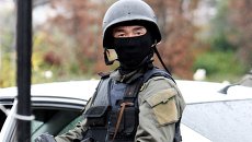 Сотрудник правоохранительных органов Киргизии. Архивное фото Сотрудник правоохранительных органов Киргизии. Архивное фото