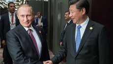 Президент России Владимир Путин и председатель Китайской Народной Республики (КНР) Си Цзиньпин во время встречи на полях саммита Группы двадцати (G20) Президент России Владимир Путин и председатель Китайской Народной Республики (КНР) Си Цзиньпин во время встречи на полях саммита Группы двадцати (G20)