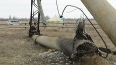 Поврежденный электрический пилон в районе села Чаплинка в Херсонской области Поврежденный электрический пилон в районе села Чаплинка в Херсонской области