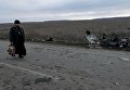 Священнослужитель у места подрыва микроавтобуса в Донецкой области Священнослужитель у места подрыва микроавтобуса в Донецкой области