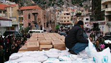 Российская гуманитарная помощь в сирийской Латакии. Архивное фото Российская гуманитарная помощь в сирийской Латакии. Архивное фото