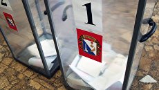 Урны с бюллетенями на избирательном участке в Севастополе в день предварительного голосования за кандидатов от партии Единая Россия, выдвигаемых на выборы в Государственную Думу РФ. Архивное фото Урны с бюллетенями на избирательном участке в Севастополе в день предварительного голосования за кандидатов от партии Единая Россия, выдвигаемых на выборы в Государственную Думу РФ. Архивное фото