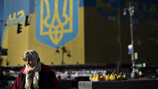 Жительница Украины продает овощи на Площади Независимости в Киеве. Архивное фото Жительница Украины продает овощи на Площади Независимости в Киеве. Архивное фото
