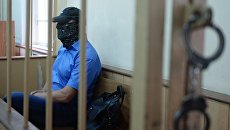 Заместитель начальника управления собственной безопасности Следственного комитета России Александр Ламонов в Лефортовском суде Москвы, где рассматривается ходатайство следствия о его аресте. Архивное фото Заместитель начальника управления собственной безопасности Следственного комитета России Александр Ламонов в Лефортовском суде Москвы, где рассматривается ходатайство следствия о его аресте. Архивное фото