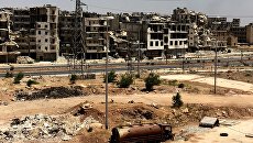 Разрушенные здания в районе Рамусе на юге города Алеппо в Сирии Разрушенные здания в районе Рамусе на юге города Алеппо в Сирии