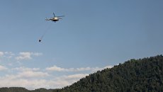 Вертолет МЧС РФ выполняет работы по устранению последствий пожара в селе Мокок Цунтинского района Республики Дагестан Вертолет МЧС РФ выполняет работы по устранению последствий пожара в селе Мокок Цунтинского района Республики Дагестан