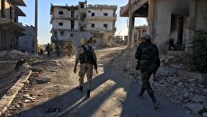Бойцы бригады ополчения Аль-Кудс в освобожденном от террористов лагере палестинских беженцев Хандарат на северо-востоке Алеппо Бойцы бригады ополчения Аль-Кудс в освобожденном от террористов лагере палестинских беженцев Хандарат на северо-востоке Алеппо