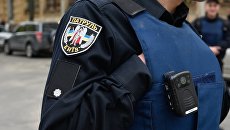 Сотрудник Украинской полиции в Киеве. Архивное фото Сотрудник Украинской полиции в Киеве. Архивное фото