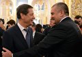 Первый заместитель председателя Госдумы РФ Александр Жуков и глава Республики Крым Сергей Аксёнов перед началом ежегодного послания президента РФ Владимира Путина Федеральному Собранию в Кремле Первый заместитель председателя Госдумы РФ Александр Жуков и глава Республики Крым Сергей Аксёнов перед началом ежегодного послания президента РФ Владимира Путина Федеральному Собранию в Кремле