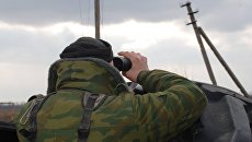 Боец ополчения ДНР в окрестностях села Коминтерново Донецкой области. Архивное фото Боец ополчения ДНР в окрестностях села Коминтерново Донецкой области. Архивное фото