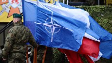 Церемония приветствия многонационального батальона НАТО под руководством США в польском Ожише. Архивное фото Церемония приветствия многонационального батальона НАТО под руководством США в польском Ожише. Архивное фото
