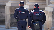 Сотрудники полиции на улице Москвы. Архивное фото Сотрудники полиции на улице Москвы. Архивное фото