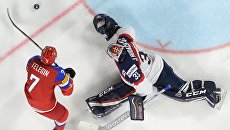 Игрок сборной России Иван Телегин и вратарь сборной Словакии Юлиус Гудачек в матче между сборными командами России и Словакии. 13 мая 2017 Игрок сборной России Иван Телегин и вратарь сборной Словакии Юлиус Гудачек в матче между сборными командами России и Словакии. 13 мая 2017
