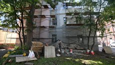 Четырехэтажный жилой дом в Москве, включенный в программу реновации. Архивное фото Четырехэтажный жилой дом в Москве, включенный в программу реновации. Архивное фото