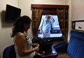 Пассажирка в купе туристического поезда Императорская Россия перед отправлением с Казанского вокзала по маршруту Москва - Пекин Пассажирка в купе туристического поезда Императорская Россия перед отправлением с Казанского вокзала по маршруту Москва - Пекин