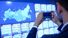 Информационные экраны в Центральной избирательной комиссии в единый день голосования. Архивное фото Информационные экраны в Центральной избирательной комиссии в единый день голосования. Архивное фото