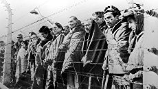 Узники концентрационного лагеря Освенцим. Архивное фото Узники концентрационного лагеря Освенцим. Архивное фото