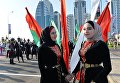 Гости в национальных костюмах во время открытия парка цветов у высотного комплекса Грозный сити в Грозном, приуроченного ко дню чеченской женщины Гости в национальных костюмах во время открытия парка цветов у высотного комплекса Грозный сити в Грозном, приуроченного ко дню чеченской женщины