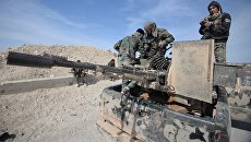 Бойцы сирийской армии в районе города Эль-Карьятейн Бойцы сирийской армии в районе города Эль-Карьятейн
