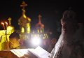 Митрополит Татарстана Феофан во время службы в Крещенский сочельник на Раифском озере неподалеку от Раифского Богородицкого мужского монастыря в Зеленодольском районе республики Татарстан Митрополит Татарстана Феофан во время службы в Крещенский сочельник на Раифском озере неподалеку от Раифского Богородицкого мужского монастыря в Зеленодольском районе республики Татарстан
