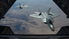 Американские истребители F-22 Raptor над территорией Сирии. Архивное фото Американские истребители F-22 Raptor над территорией Сирии. Архивное фото