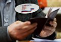 Член участковой избирательной комиссии во время голосования на выборах президента Российской Федерации на избирательном участке в Новосибирске. 18 марта 2018 Член участковой избирательной комиссии во время голосования на выборах президента Российской Федерации на избирательном участке в Новосибирске. 18 марта 2018