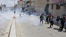 Участники протеста в Палестине против переноса посольства США в Иерусалим. Архивное фото Участники протеста в Палестине против переноса посольства США в Иерусалим. Архивное фото