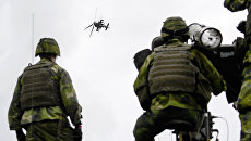 Шведские военные во время учений. Архивное фото Шведские военные во время учений. Архивное фото