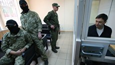 Руководитель портала РИА Новости Украина Кирилл Вышинский во время рассмотрения апелляции на арест в Херсонском суде. Архивное фото Руководитель портала РИА Новости Украина Кирилл Вышинский во время рассмотрения апелляции на арест в Херсонском суде. Архивное фото