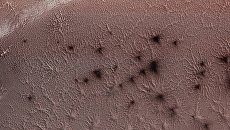 Снимок орбитального аппарата NASA с орбиты Марса с изображением Южного полюса Марса. Архивное фото Снимок орбитального аппарата NASA с орбиты Марса с изображением Южного полюса Марса. Архивное фото