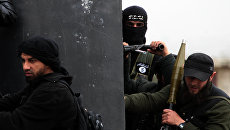 Боевики группировки Джебхат ан-Нусра* в Сирии. Архивное фото Боевики группировки Джебхат ан-Нусра* в Сирии. Архивное фото