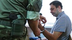 Руководитель портала РИА Новости Украина Кирилл Вышинский в зале апелляционного суда Херсонской области Украины. Архивное фото Руководитель портала РИА Новости Украина Кирилл Вышинский в зале апелляционного суда Херсонской области Украины. Архивное фото