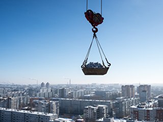 Строительство многоэтажного жилого дома. Архивное фото Строительство многоэтажного жилого дома. Архивное фото