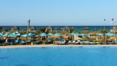 Пляж отеля Sensimar Palm Beach Palace Djerba на острове Джерба в Тунисе. Пляж отеля Sensimar Palm Beach Palace Djerba на острове Джерба в Тунисе.