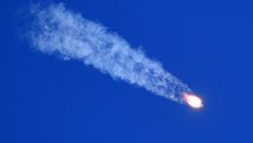 Ракета-носитель Союз-ФГ с пилотируемым кораблем Союз МС-10 после старта с космодрома Байконур Ракета-носитель Союз-ФГ с пилотируемым кораблем Союз МС-10 после старта с космодрома Байконур