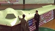 Военные Ирана показали сбитый американский беспилотник RQ-170 Военные Ирана показали сбитый американский беспилотник RQ-170