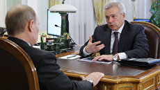 Владимир Путин и Вагит Алекперов. Архивное фото Владимир Путин и Вагит Алекперов. Архивное фото